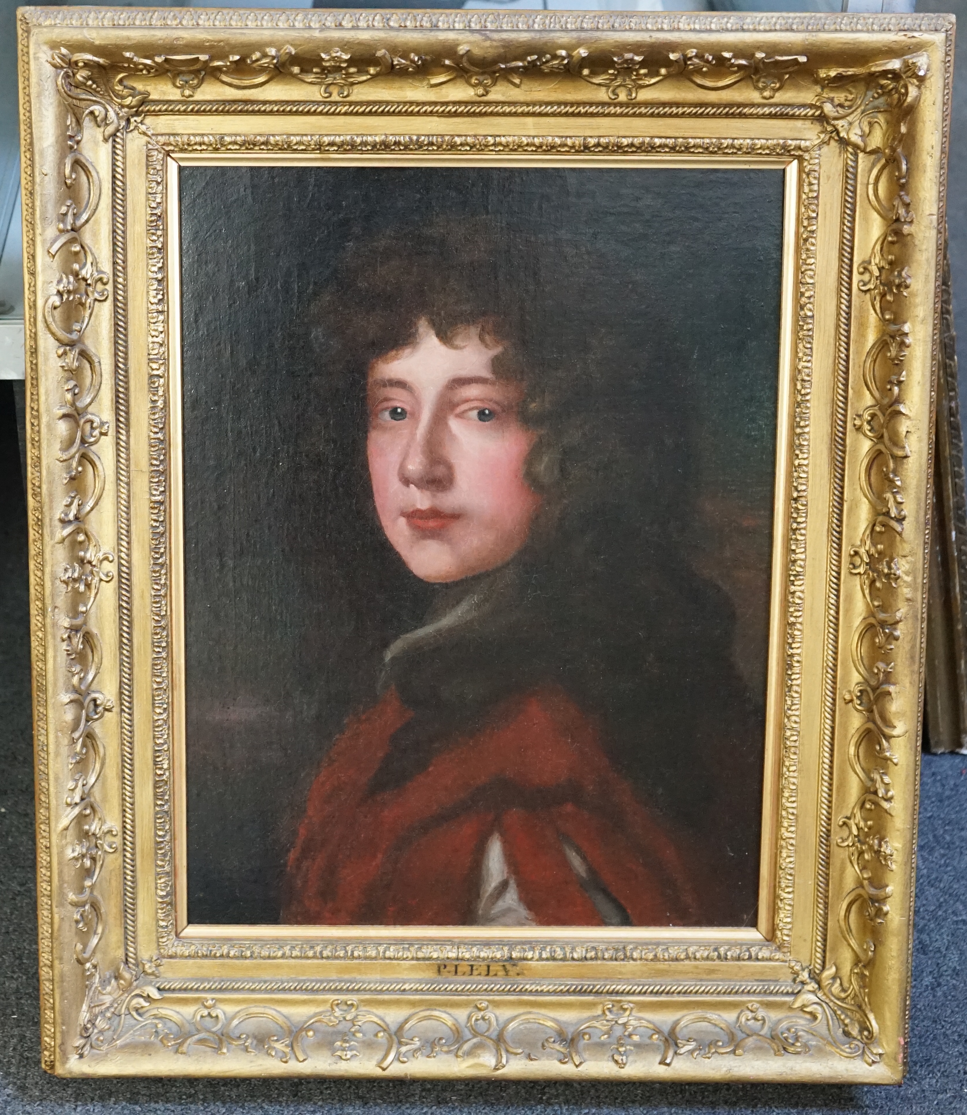 After Sir Peter Lely (1618-1680), oil on canvas, Head and shoulders portrait of a young gentleman, 48 x 37cm, ornate gilt framed. Condition - fair, re-lined